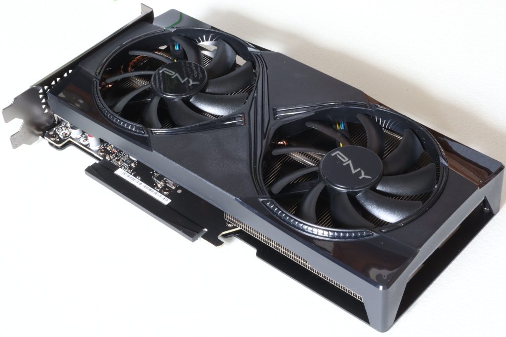 PNY GeForce RTX 5060 Ti graphics card with two cooling fans on a light surface.